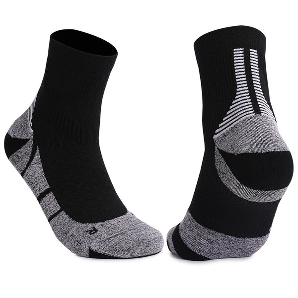 Pair of black and gray basketball socks with ankle support and cushioned areas.
