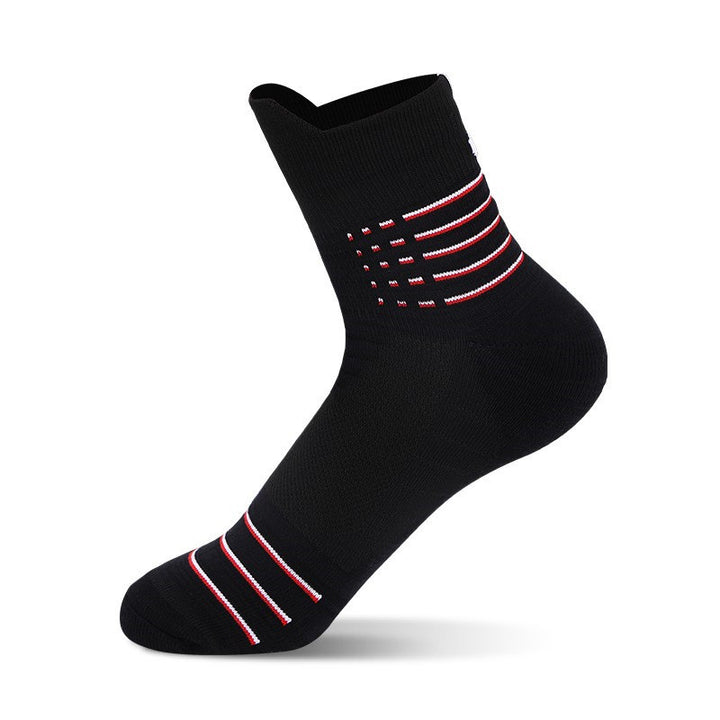 A single black sock with red stripes and dotted design on a white background.