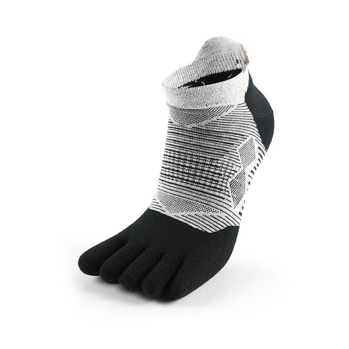 Black and white patterned toe sock with an ankle cuff on a white background.