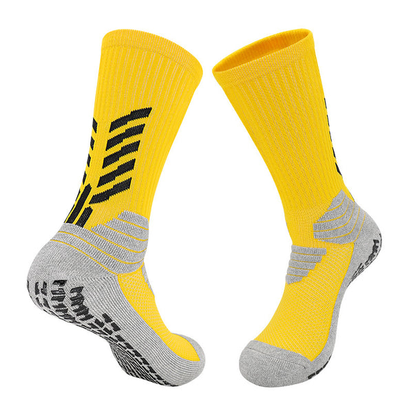 A pair of bright yellow basketball socks with gray and white details, equipped with ergonomic cushioning, arch support, and a breathable design.