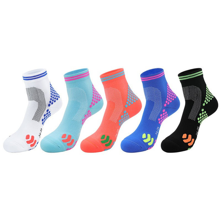 A set of five colorful quarter length socks with varying patterns and anti-slip logos on the soles.