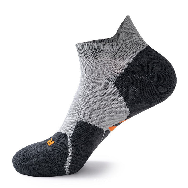 Gray and black gradient ankle socks with orange logo.
