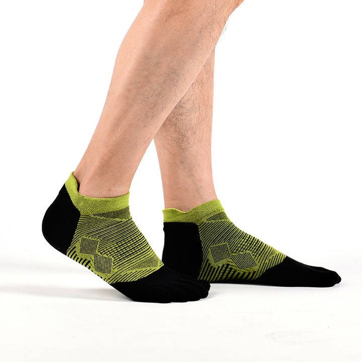 Person standing in black and lime green patterned ankle socks.