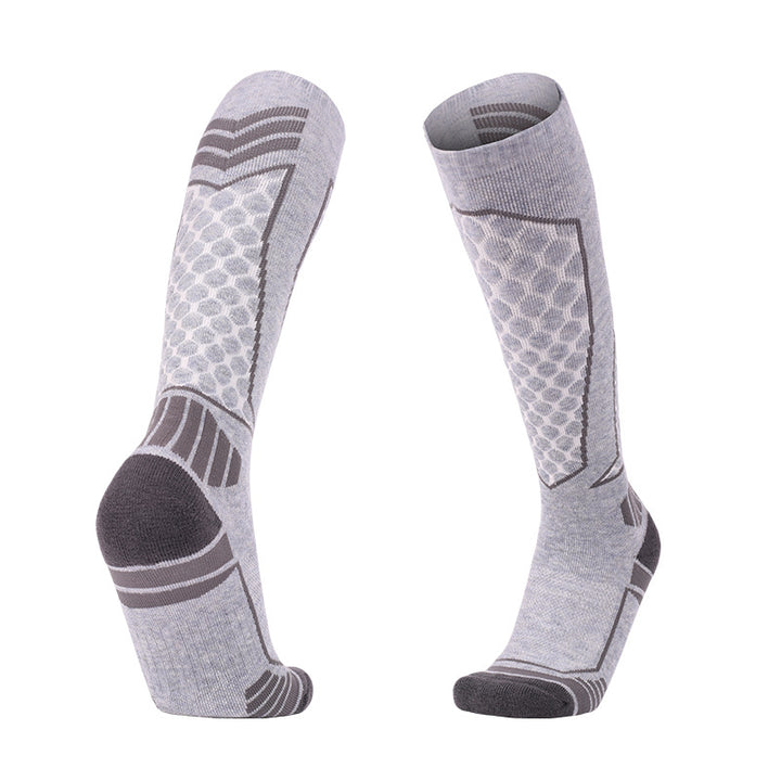 Thick padded merino wool skiing over-the-calf socks in gray for warmth and support.