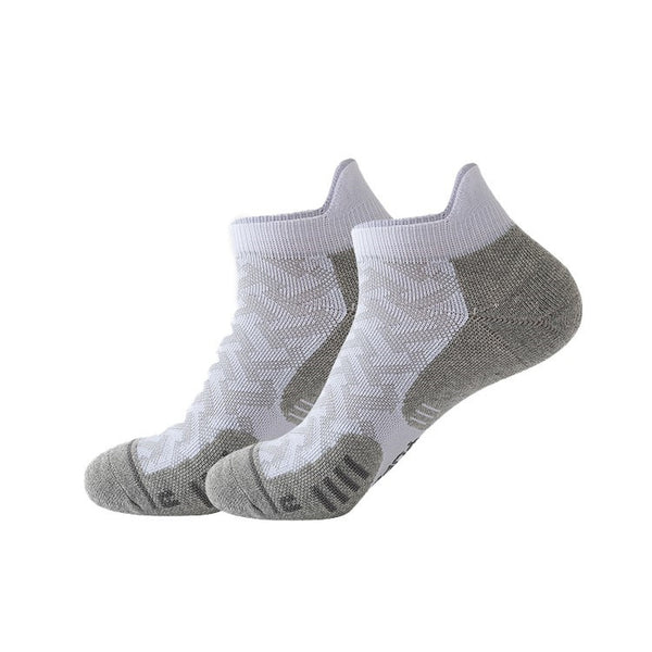 Pair of white ankle socks with grey cushioned soles.