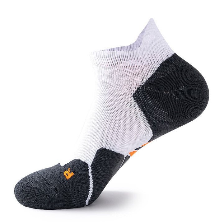 White and black gradient ankle socks with orange logo.