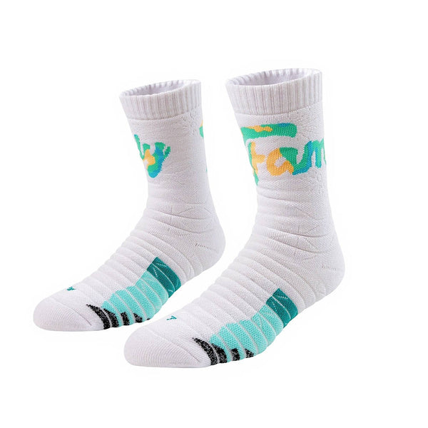 White crew socks with playful green 'fun' lettering and teal stripes on the foot, presented on a white backdrop.