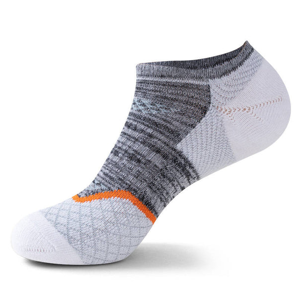 White and grey ankle sock with orange detailing, displayed against a white backdrop.