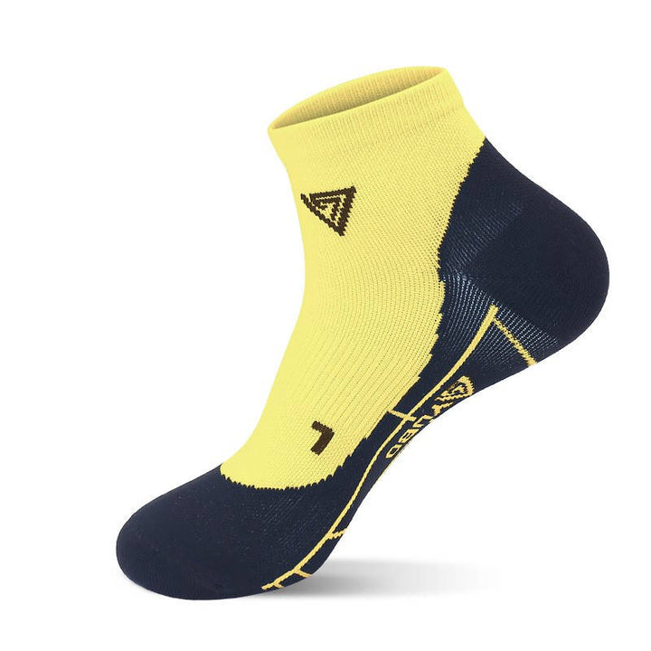 A single yellow ankle sock with a white geometric pattern design.